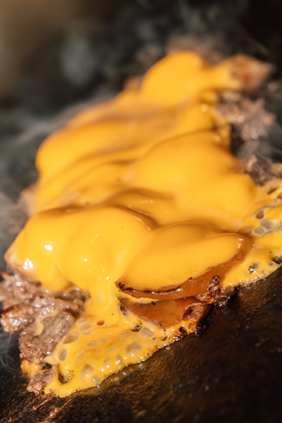 American cheese melting over Grade A steak
